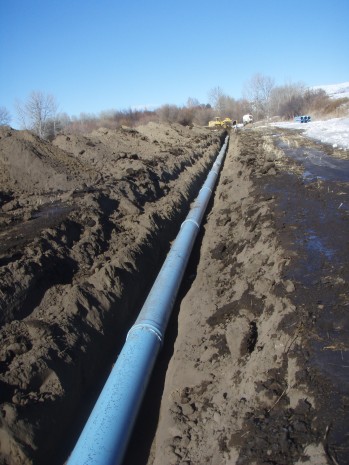 Installing irrigation pipeline on Cowiche Creek